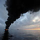 Dark clouds of smoke and fire emerge as oil burns during a controlled fire in the Gulf of Mexico. The U.S. Coast Guard working in partnership with BP PLC, local residents, and other federal agencies conducted the controlled burn to aid in preventing the spread of oil following the April 20 explosion on Mobile Offshore Drilling Unit Deepwater Horizon. © U.S. Navy / Mass Communication Specialist 2nd Class Justin Stumberg