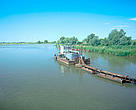Wood transport on the Danube channel near Ermakow Island in the lower Danube River basin, Ukraine.