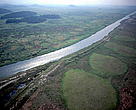 Aerial view of a canalised section of the São João River. Rio de Janeiro State, Brazil