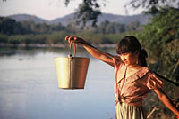 Tribal girl collecting water from the Srepok River, Vietnam. / ©: WWF-Canon / Elizabeth KEMF Tribal girl collecting water from the Srepok River, Vietnam. / ©: WWF-Canon / Elizabeth KEMF