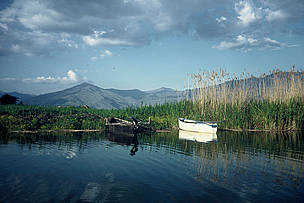 The Prespa Lakes are under threat from intensive agricultural practices. / ©: WWF-Canon / Georgia VALLAORAS Fishing boats, wet meadows, and reeds. Prespa lakes, Greece. / ©: WWF-Canon / Georgia VALLAORAS