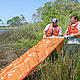 In an effort to limit the potential impact of the oil slick from the Deepwater Horizon accident, members of the U.S. Naval Air Station Pensacola Pollution Response unit set oil containment booms to protect environmentally sensitive grass beds along the U.S. Gulf Coast. The booms will not be effective in stopping any oil that dissolves in the water, which continues to be deadly for marine life - ... © U.S. Navy / Patrick Nichols