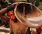 Solitary Gold-miners, 'garimpieros solteros' panning for gold in tropical rainforest in the Amazon.