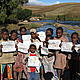 Children showing their art after the painting activity © WWF / Seraphine Wegner