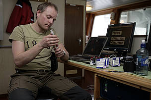 Magnus Andersen, polar bear researcher at the Norwegian Polar Institute, conducts tests onboard the arctic research vessel Lance.