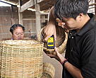 Staff is testing percentage of moisture of the rattan basket before going to another quality controlled stage 