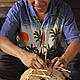 Mr. Kensy Milamith, vice village head of Thaveng Village, Bolikhamxay Province, is proudly to tell about his income earning from weaving rattan basket. © N.Promsouvanh