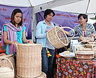 Ms Att Sreynak (second from left to right) admires a rattan basket at One village One Product fair. 
