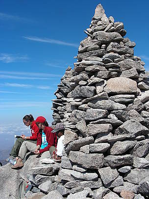 Alice, Bette, and Florinne relaxing on the summit of the peak formerly known as Pic Boby (after a ... / ©: Nick Nadeau / ©: Nick Nadeau