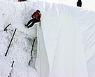 Workers fixing the fleece cover which is supposed to prevent the melting of Andermatt's Gurschen glacier.