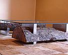 One of the 150 art pieces, a glass, steel and wood table made by Arketipo