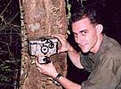 Barney Long rigging a camera trap in the forest. / &copy;: WWF-Canon
