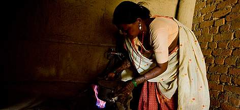 Cooking with a biogas stove, instead of burning firewood, eases the workload of women and saves ... / ©: Simon de Trey White / WWF-UK rel=