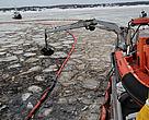 Crane boat next to oil spill in Oslo Fjord, Norway. February 2011