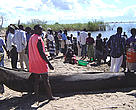Waiting for fishermen to bring a day's catch to the shore on lake Malawi.