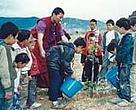 Students putting environmental education into practice,Yunnan Province, China.<BR>