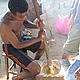 Sechel making banana cake, our favourite! Anjialavabe, September 2006 © WWF / Claire Balbo