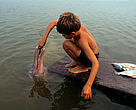 Boutu or Pink river dolphin, Araguaia river, Brazil
Boy feeding an Amazon river dolphin (Inia geoffrensis), river Araguaia, village Xambeoà, state of Tocantins, Brazil
