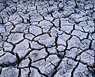 Cracked, dry earth is all that is left in many of the rivers and creeks as a result of extreme drought conditions. Western New South Wales, Australia.