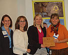 Avon’s Susan Heaney and Tricia Heinz accept Commitment Plaque from WWF-US COO, Marcia Marsh.