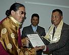 Amchi Namgyal Rinpoche (left) receiving the abraham conservation award from Dr Ghana Shyam Gurung(right)