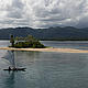 A homemade dug-out canoe glides across the glassy waters off the south coast of New Britain during the filming of the IMAX® 3D film Under the Sea 3D. © 2008 Jones/Shimlock used with permission by Warner Bros. Entertainment Inc.