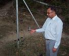 Mr Anil Kumar Sharma, a local journalist showing a broken electric fence: a sign of wildlife-human conflict