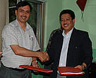 Dr K. C. Poudel, DG – Department of Forests and Mr. Anil Manandhar , CR – WWF Nepal shake hands after signing the grant agreement. 