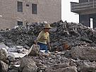 Woman in the ruins of demolished houses in Fengolu city near the Yangtze River. The city was ... / ©: Claire DOOLE / WWF-Canon / ©: Claire DOOLE / WWF-Canon