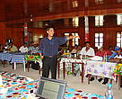 Man in front of participants in a meeting