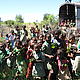Children helping load a truck with small trees always
happy to help, and curious © WWF / Ian Martin