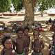 Under a tamarind tree, where all gatherings and important exchanges take place. Yep, the kids are ubiquitous! © WWF / Katherine Davey