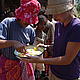 Preparing genagena, a nutricious cake for local Malagasy people. Henintsoa and Cara in Amboangy, Madagascar © WWF / Cara Brook