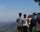 Explorers, Ranto, Kuni, Christa, and Sergio, stare out across the Vondrozo Corridor. Near Madiorano, Madagascar