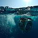The massive IMAX® 3D camera makes waves of its own as it plunges into the waters of Indonesia on another shoot during the filming of the IMAX 3D film Under the Sea 3D. © 2008 Drew Fellman used with permission by Warner Bros. Entertainment Inc.