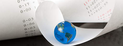 77% of us are living in ecological debt. / ©: iStockPhoto / Marianne Guntow Adding Machine Tape with Bright Blue Globe rel=