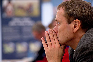 Kim Carstensen listening to the speakers at the opening of the WWF Arctic tent in Nytorv Square, COP15, United Nations Climate Change Conference, Copenhagen, Denmark.