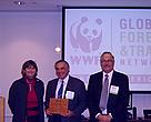 Marcia Marsh, COO of WWF-US, presents Kimberly-Clark’s Howard Sharfstein and Skip Krasny with a plaque to commemorate their participation in GFTN-North America.