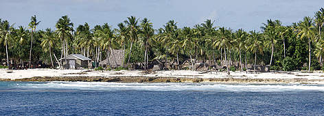 Low-lying islands such as Kiribati in the Pacific Ocean are threatened by rising sea levels as a ... / ©: Cat Holloway / WWF-Canon Orona settlement on the small island nation of Kiribati in the South Pacific Ocean. rel=