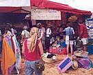 Shoppers at the Annual Christmas craft sale throng the WWF Kiunga project stand showcasing crafts and toys made from flipflops.