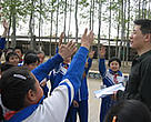 One of the Lafarge Green Ambassadors talks to schoolchildren.
