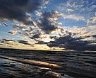 Waves roll onto the shores of Lake Ontario at sunset, Ontario, Canada.