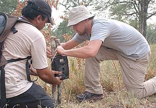 Leonardo Dicaprio fixes a camera trap with WWF staff Pradeep Khanal at Nepal's Bardia National Park.