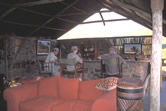 Tourists relax at the bar in the Damaraland Camp, a tourist lodge managed by the Torra Conservancy ... / ©: WWF-Canon / Jan Vertefeuille Tourists relax at the bar in the Damaraland Camp, a tourist lodge managed by the Torra Conservancy ... / ©: WWF-Canon / Jan Vertefeuille