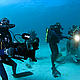 The filmmakers and camera crew give a lionfish the spotlight at the manta cleaning station at Gonu Bala Bala Island while filming the IMAX® 3D film Under the Sea 3D. © 2008 Jeff Wildermuth used with permission by Warner Bros. Entertainment Inc.