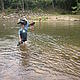 Hiking... even through rivers, like Julien and Claire do here in Andrakengy © WWF\ Corinne Eisenring