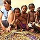 Learning how to make raffia mats from our neighbours. © Bette Harms