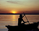 A lone fisherman paddles homewards on Lake Malawi.