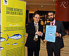 Dr Sergi Tudela, Head of Fisheries at WWF Mediterranean, presents WWF's Tuna Market Manifesto to Dr Fabio Hazin, Chairman of ICCAT, in Paris in November 2010.