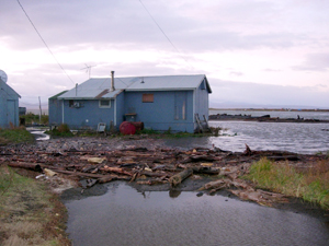 A home sits perilously close to the water's edge. Unalakleet, Alaska. / &copy;: Native Village of Unalakleet